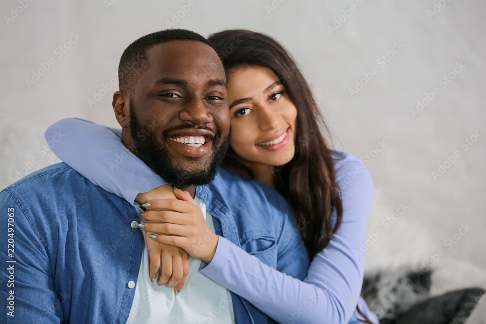 Happy African-American couple at home Happy African-American couple at home