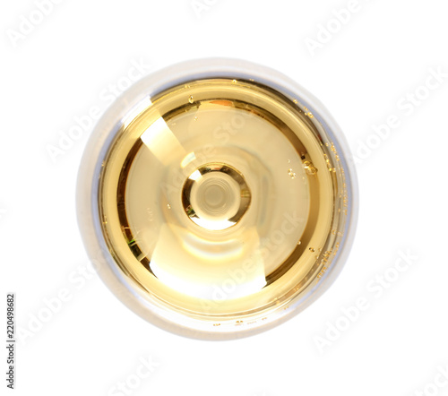 Glass of champagne on white background, top view
