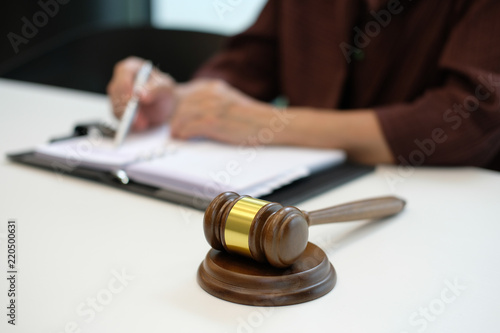 judge oranize plan, write note with legal law gavel at courtroom. lawyer attorney justice at court