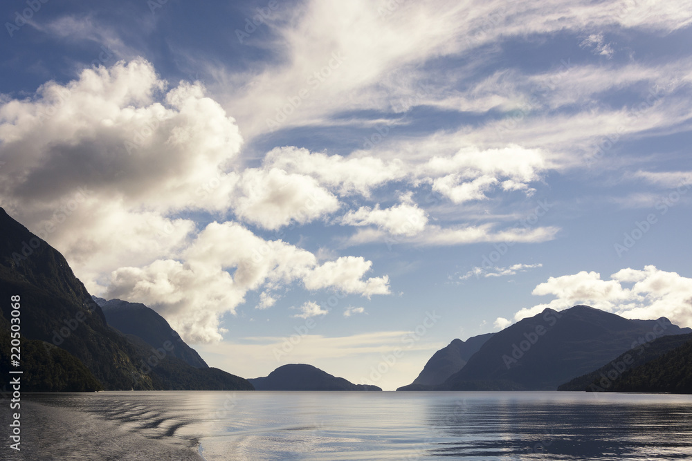 Beautiful view on the scenic landscape of the Doubtful Sound, Fiordland, New Zealand. This rough and wild part of the West coast of the South Island is a fantastic touristic destination.