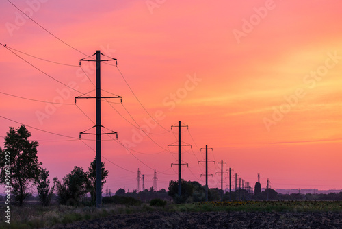 Obraz na płótnie Rural landscape with high-voltage line on sunset w salonie