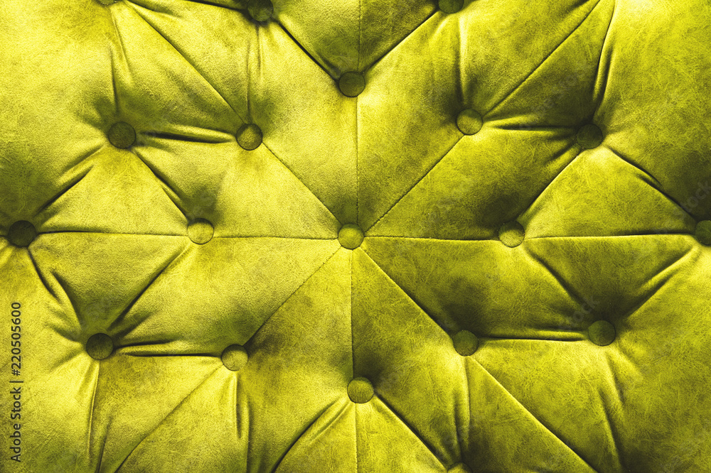 Velor surface of sofa close-up. Training equipment-velor mats tightened with buttons. Yellow chesterfield style quilted upholstery background close up Velor surface of sofa close-up. Training equipment-velor mats tightened with buttons. Yellow chesterfield style quilted upholstery background close up