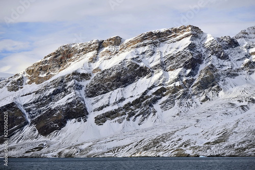 The picturesque mountains of the east coast of Greenland. photo