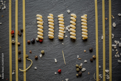 Italian pasta knolling / Assorted dried pasta on stone plate