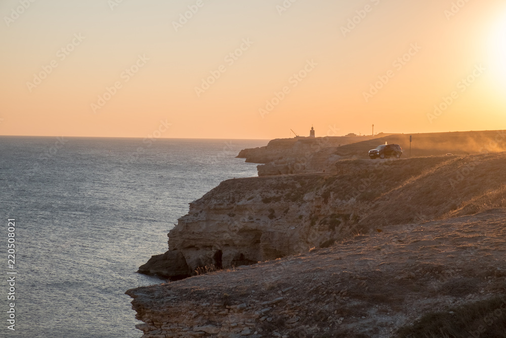 Crimean Peninsula-Cape Tarkhankut summer is pure Black sea rocky beach in Sunny sunset