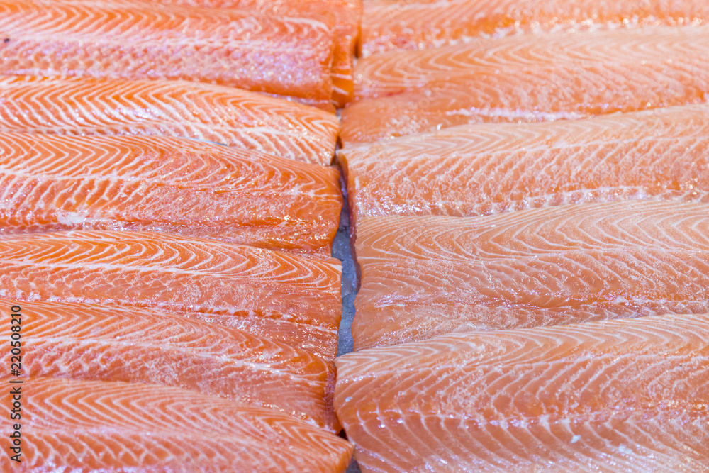 Salmon Fillet in Ice on the supermarket counter. Fillet of red fish in the ice in the supermarket. Marine healthy food Salmon Fillet in Ice on the supermarket counter. Fillet of red fish in the ice in the supermarket. Marine healthy food