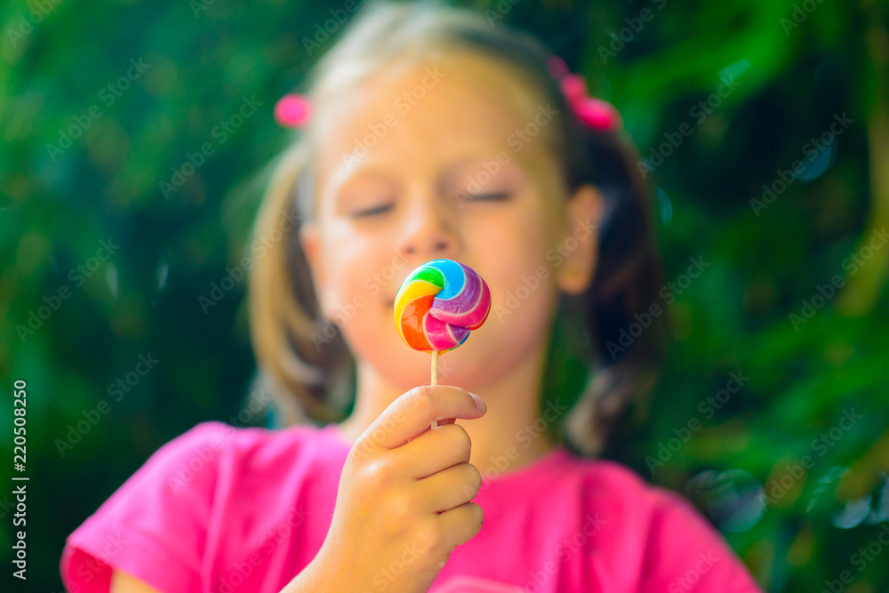 little girl with lollipop - shallow depth of field