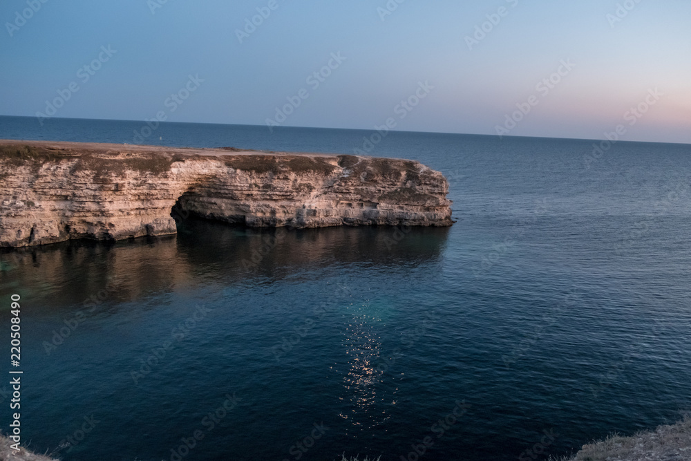 The Crimean Peninsula-Cape Tarkhankut summer is pure Black sea, the rocky shore of evening