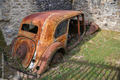 Destroyed cars during World War 2 in the city Oradour sur Glane France photo