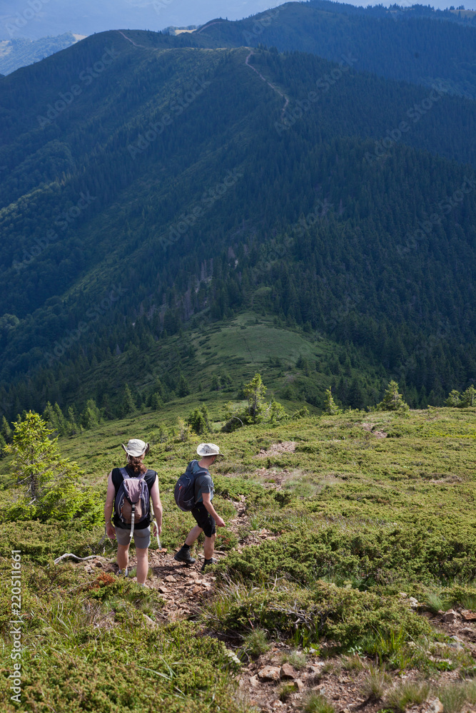 male hiker trekking in the mountains