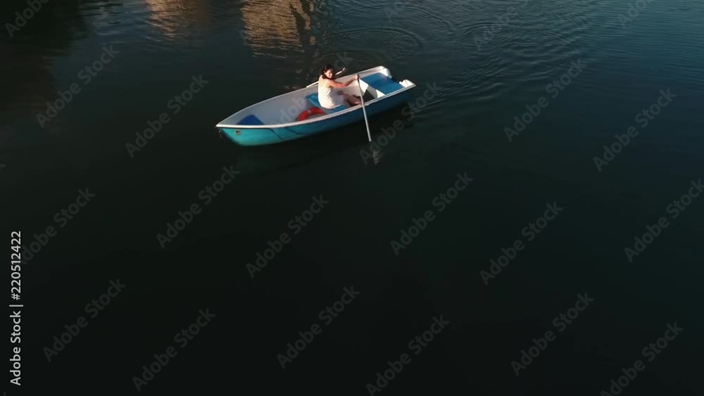 Young girl boating on the lake Young girl boating on the lake