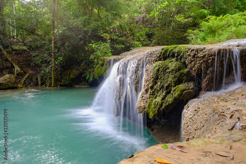 Fototapeta Naklejka Na Ścianę i Meble -  Erawan waterfall is a large and beautiful on the banks of Kwai Yai river, it is located in Si sawat District, Kanchanaburi province, Thailand.