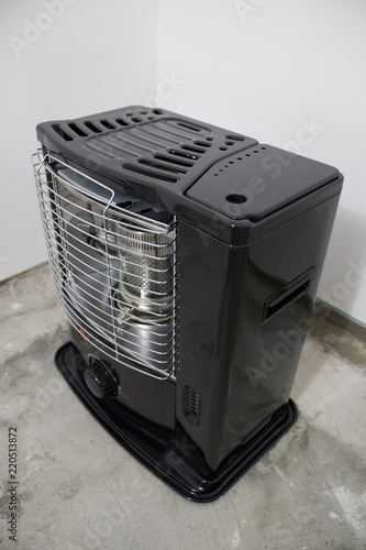 Black kerosene heater in a white background