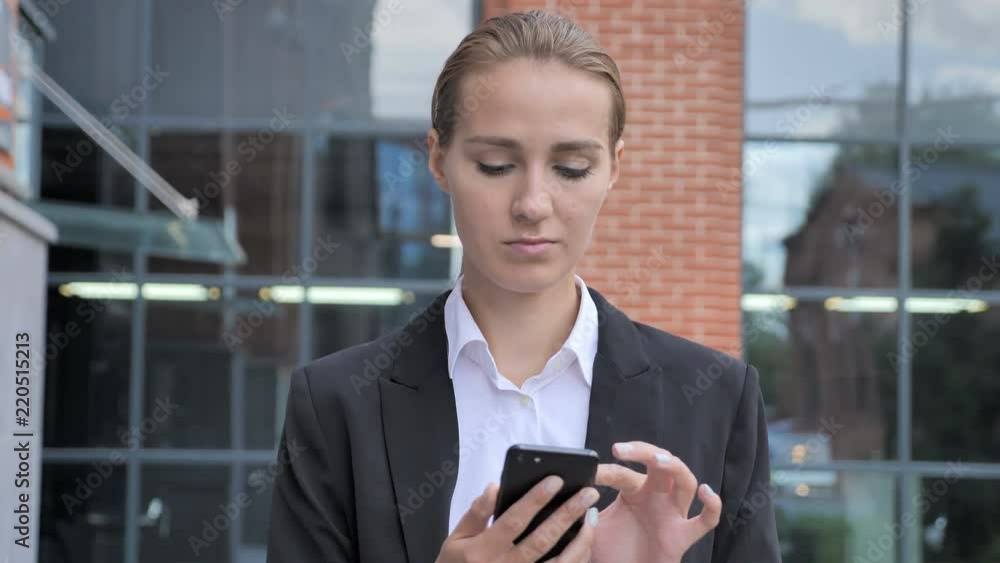 Walking Businesswoman Busy Using Smartphone Ouside Office Walking Businesswoman Busy Using Smartphone Ouside Office