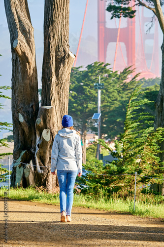 Photography Woman walking on California Coastal Trail in San Francisco
