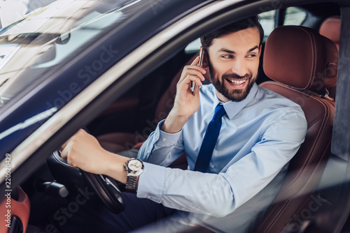 businessman talking on cellphone in the car © Afshar Tetyana