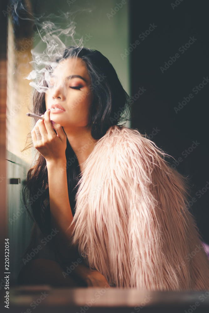 Portrait of sexy asian woman is smoking Stock Photo | Adobe Stock