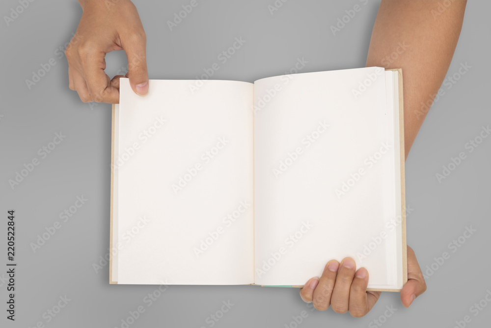Obraz premium Top view- two hands hold a empty book spread