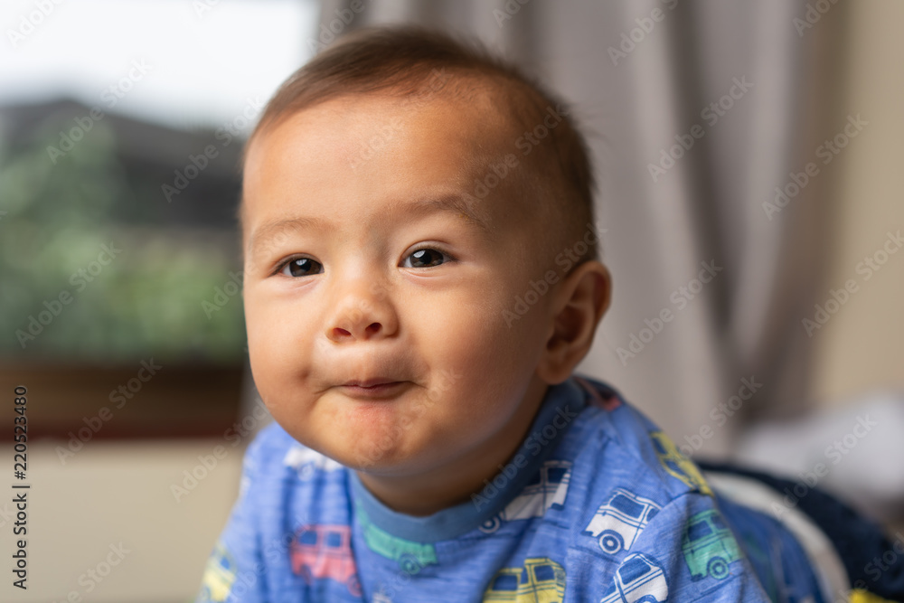 cute young boy playing on the bed cute young boy playing on the bed