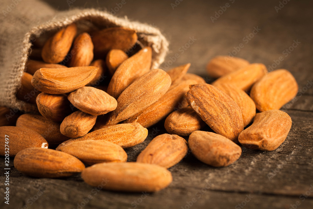 Almonds on wooden background Almonds on wooden background