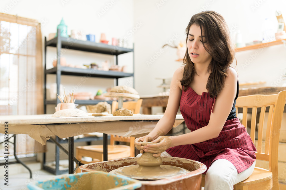 Woman Learning The Art Of Pottery In Studio Woman Learning The Art Of Pottery In Studio