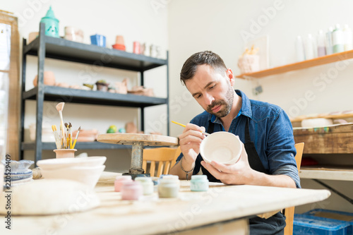 Pottery Expert Painting Bowl Made Of Clay
