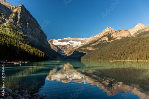 Amazing lake surrounded by mountains and glaciers in a blue sky day in Banff National Park in Canada