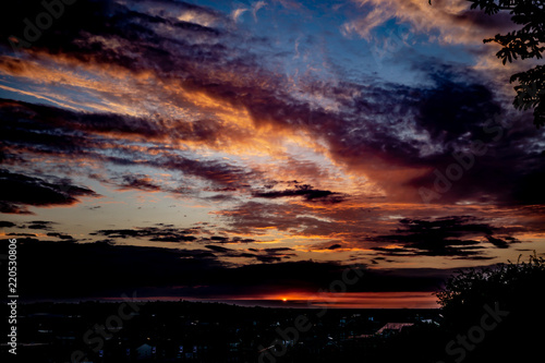 Vibrant clouds lit up by the setting sun.