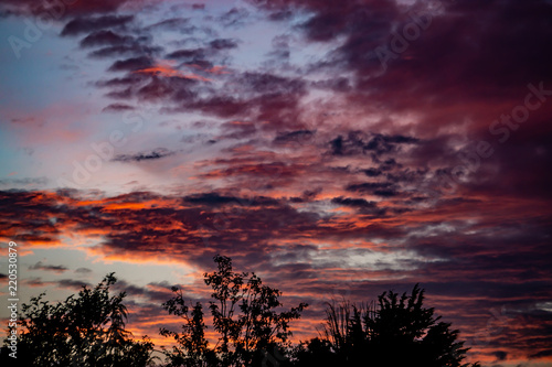 Vibrant clouds lit up by the setting sun.