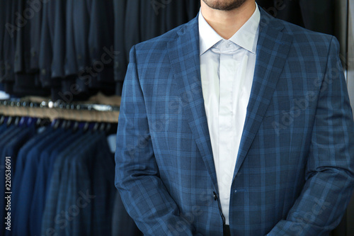 Young man in elegant suit a...