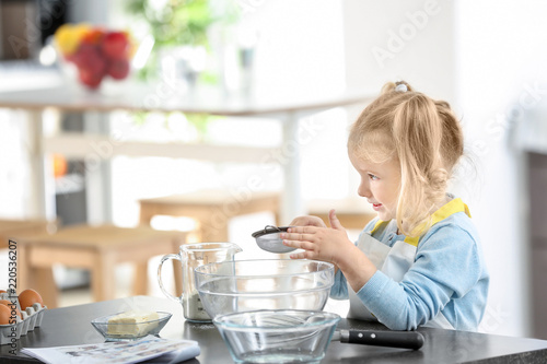 Cute little girl preparing ...