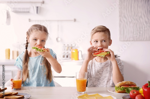 Little children having brea...