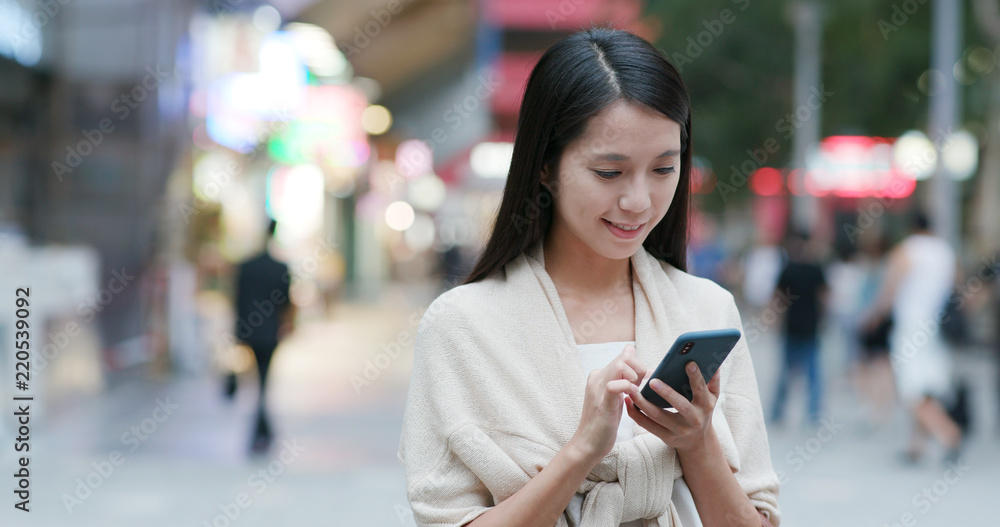 Fototapeta premium Woman use of mobile phone phone online