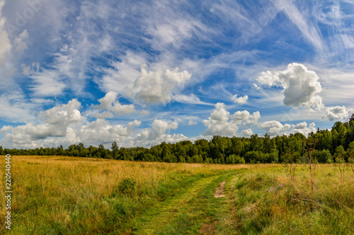 Landscape with clouds in the summer sky. The last days of August.