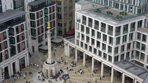 Aerial view of Paternoster square in sunny day with people in London city, UK.