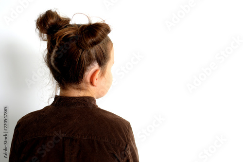 Young girl with hair buns.