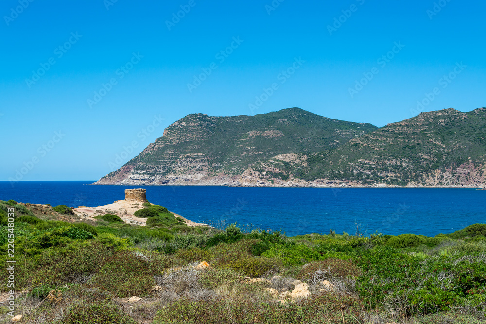 Landscape of sardinian coast with ancient tower
