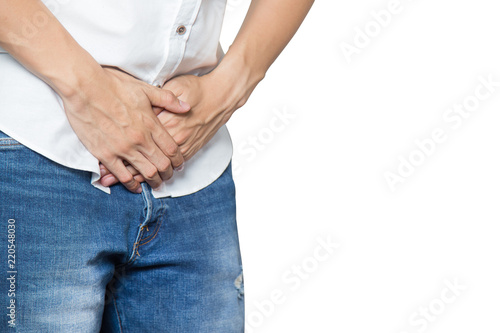 Male hands holding on middle crotch of trousers with prostate inflammation, Prostate cancer, Men's health care concept isolated on white.
