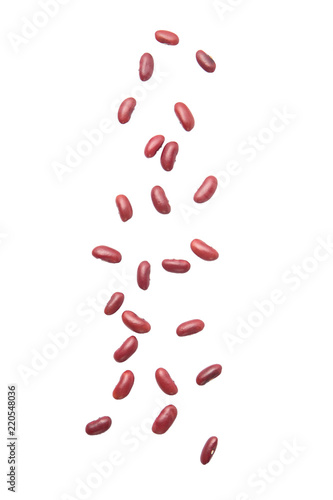 Red beans falling isolated on the white background.