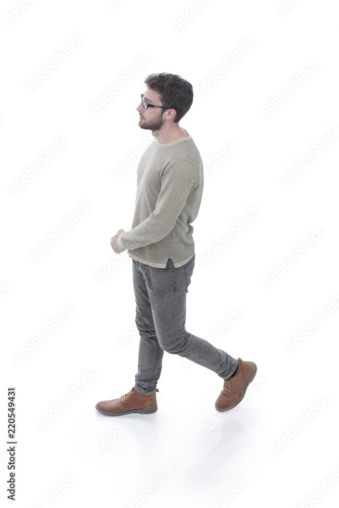 side view. modern young man confidently goes forward. side view. modern young man confidently goes forward.