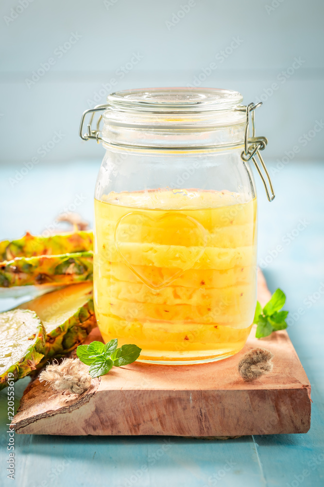 Sweet canned pineapple with sugar and mint leaf Sweet canned pineapple with sugar and mint leaf