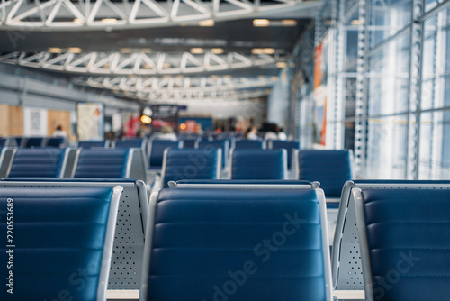Row of seats in airport waiting zone, nobody