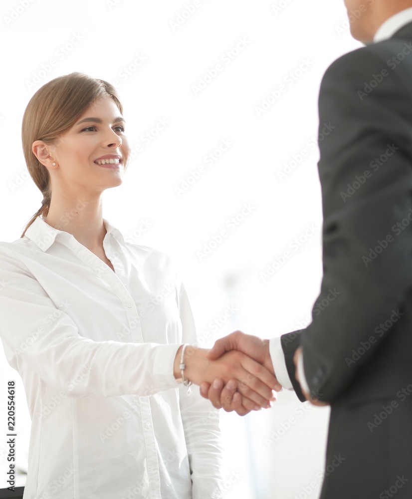 handshake young business woman with a colleague handshake young business woman with a colleague