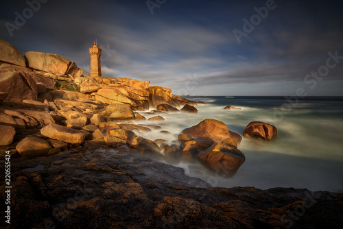 Lighthouse among the red rocks of Perros-Guirec, France