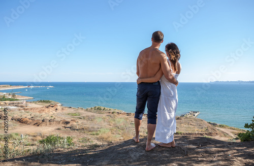 Happy couple on the sea background