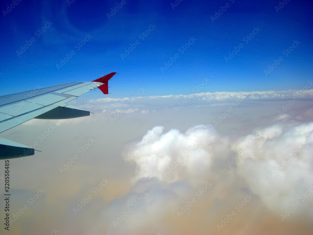 Fototapeta premium Beautiful blue sky with wonderful white clouds shown from airplane window