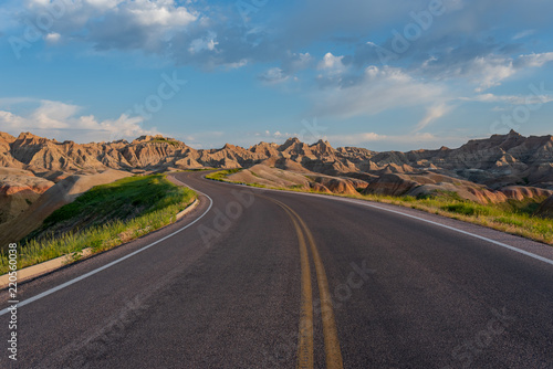 Road Winds Through Badlands Rock Formations
