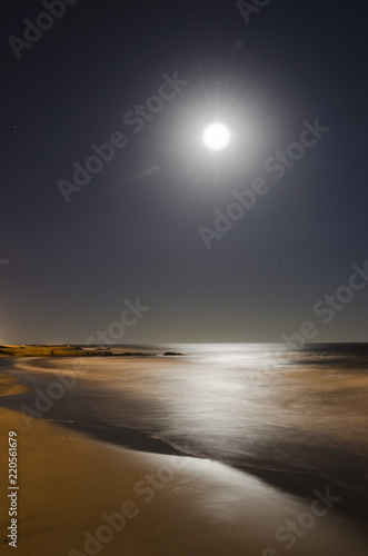 long exposure on the beach with a full moon