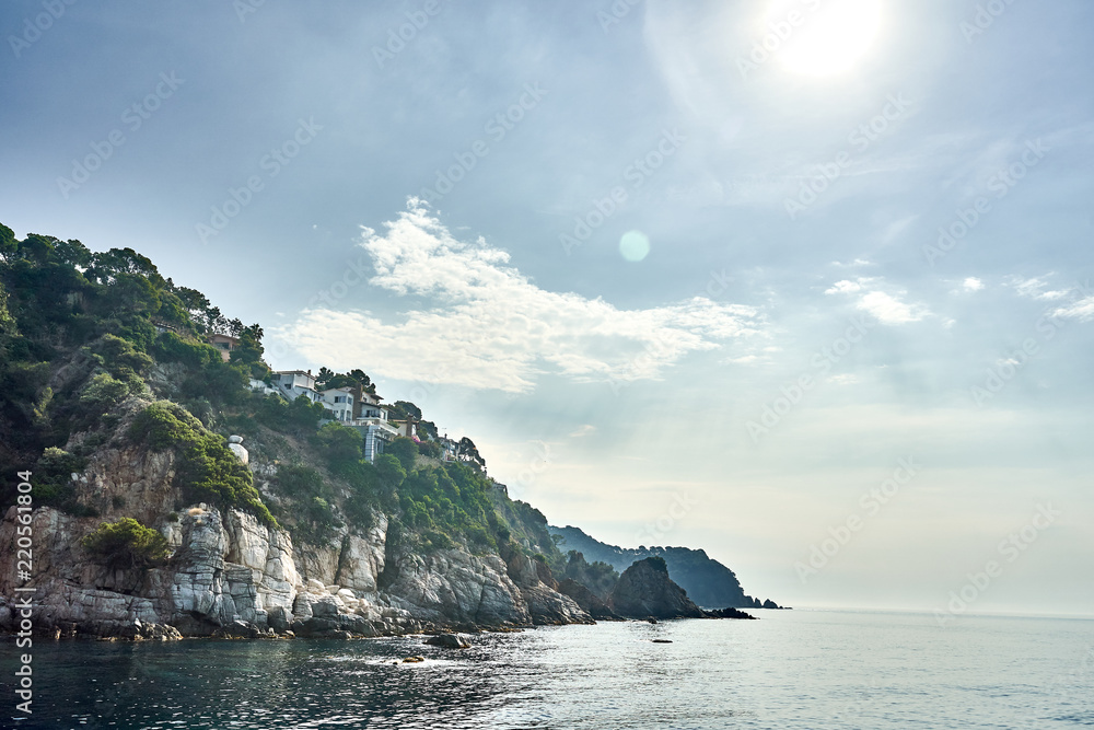 Landscape of Rocks on the coast of Lloret de Mar Tossa de Mar in a beautiful summer day, Costa Brava, Catalonia, Spain