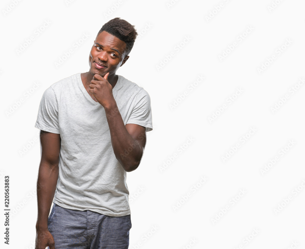 Young african american man over isolated background with hand on chin thinking about question, pensive expression. Smiling with thoughtful face. Doubt concept. Young african american man over isolated background with hand on chin thinking about question, pensive expression. Smiling with thoughtful face. Doubt concept.